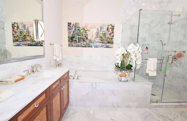 bathroom with vanity, a garden tub, and a stall shower