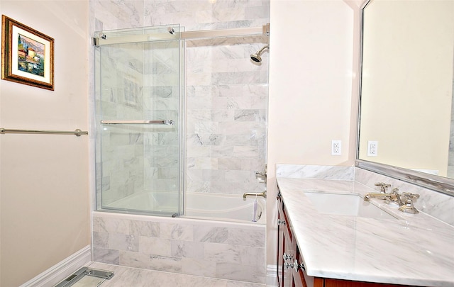 bathroom with vanity and tiled shower / bath