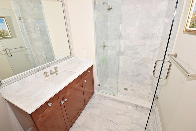 bathroom featuring vanity, a stall shower, and marble finish floor