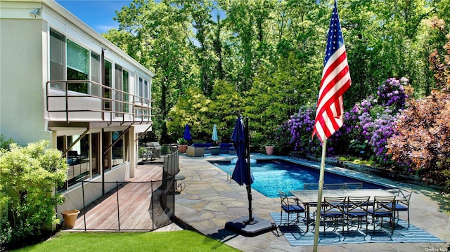 outdoor pool featuring a patio and outdoor dining space