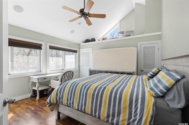 bedroom featuring vaulted ceiling, wood finished floors, baseboards, and ceiling fan