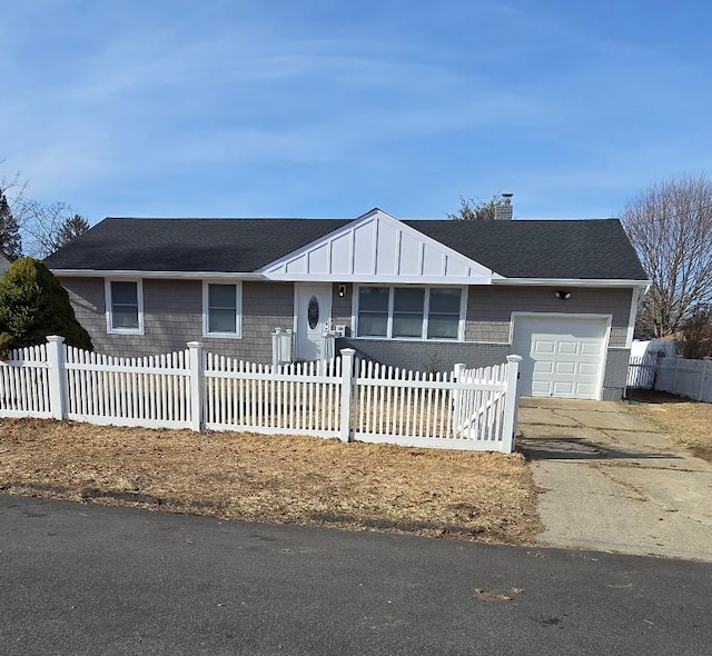 single story home featuring a fenced front yard, a garage, driveway, and a chimney