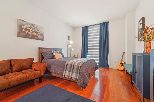 bedroom featuring wood finished floors