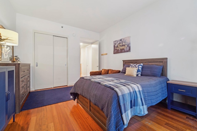 bedroom with a closet and wood finished floors