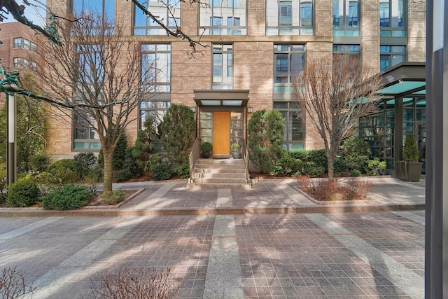 property entrance with brick siding