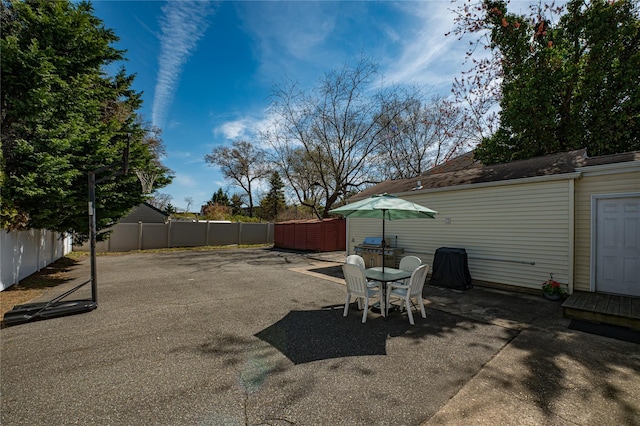 view of patio / terrace featuring fence