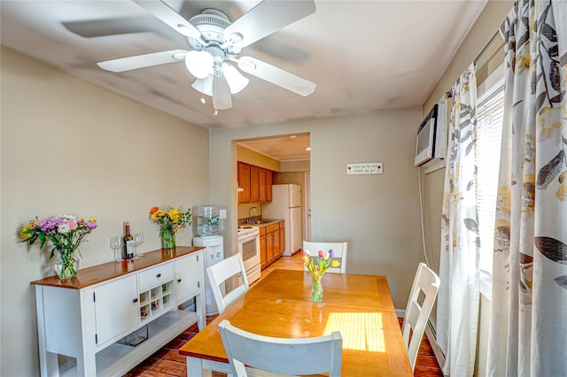 dining space with light wood-style flooring and ceiling fan