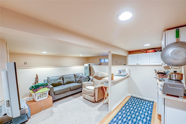 interior space featuring light wood-type flooring and recessed lighting