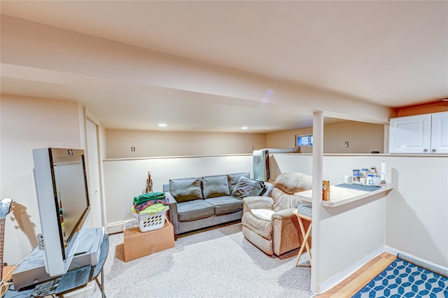 living area with baseboards and recessed lighting