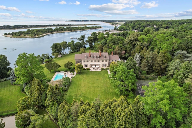 bird's eye view featuring a forest view and a water view