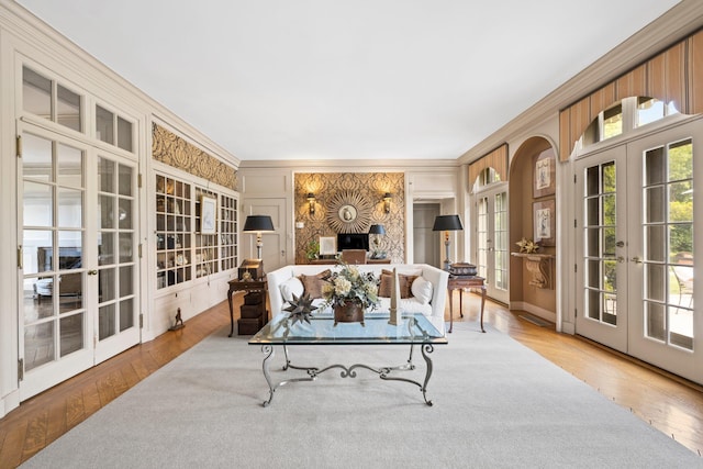 sunroom / solarium featuring french doors