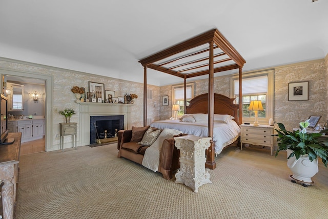 carpeted bedroom with a fireplace with flush hearth and wallpapered walls