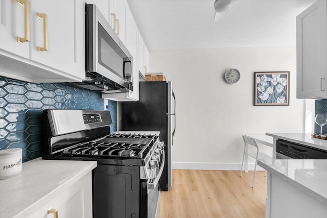 kitchen with light wood-type flooring, baseboards, tasteful backsplash, and stainless steel appliances