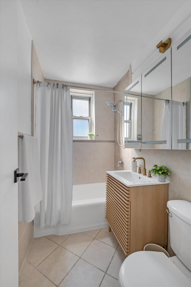 bathroom featuring tile walls, toilet, shower / bathtub combination with curtain, and tile patterned floors