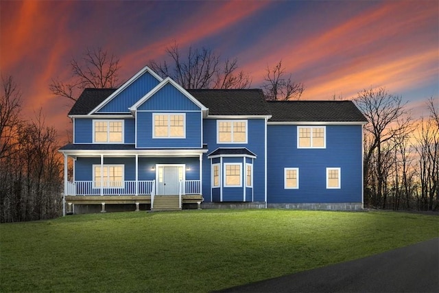 view of front facade featuring a porch and a front lawn