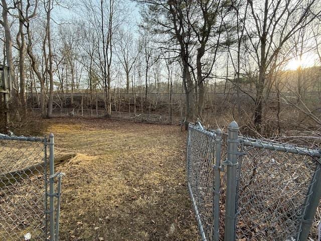 view of yard featuring a gate and fence