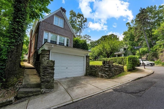 garage with concrete driveway