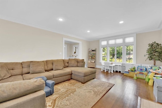 living room with recessed lighting, crown molding, and hardwood / wood-style flooring