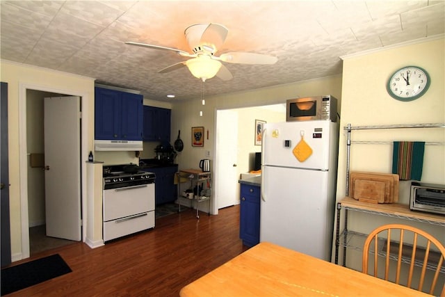 kitchen featuring blue cabinets, under cabinet range hood, dark wood finished floors, white appliances, and ceiling fan