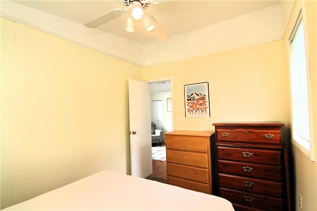 bedroom featuring a ceiling fan and wood finished floors