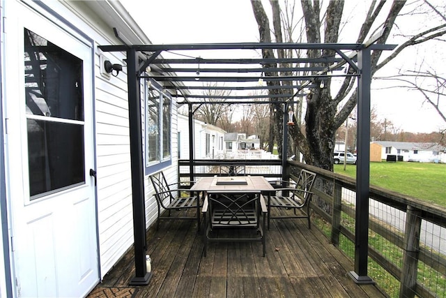 wooden terrace with a lawn and a residential view