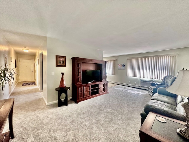 carpeted living area featuring baseboards and a baseboard radiator