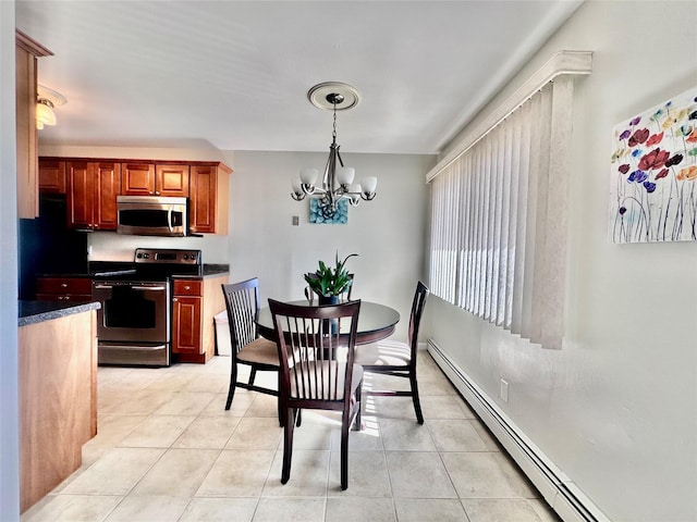 dining room with a notable chandelier, baseboard heating, and light tile patterned flooring