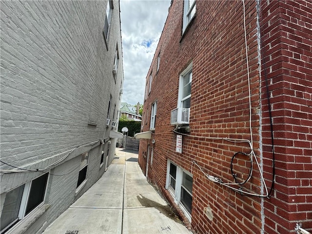 view of side of home featuring brick siding