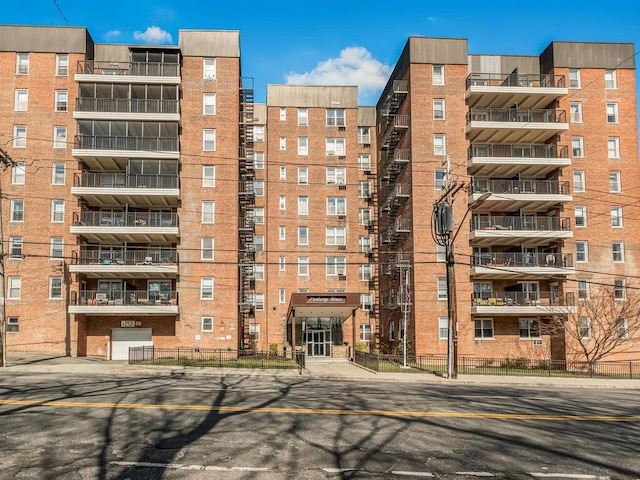 view of building exterior featuring fence