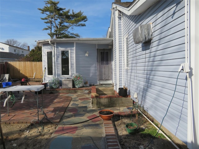 view of patio / terrace featuring entry steps and fence