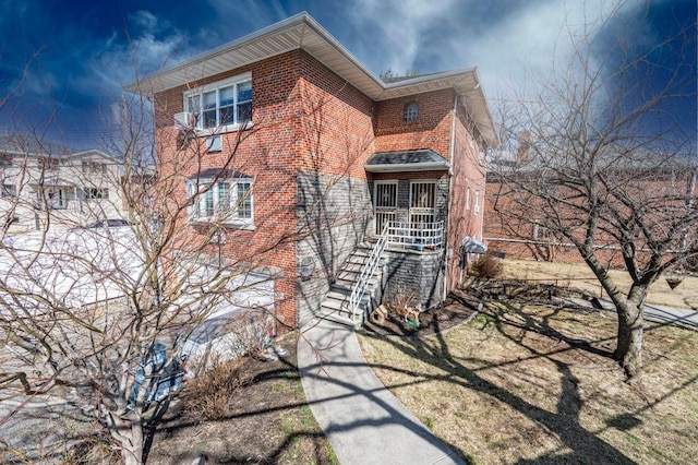 3125 Spencer Dr, Bronx, NY 10465 - view of side of home featuring stairway and brick siding
