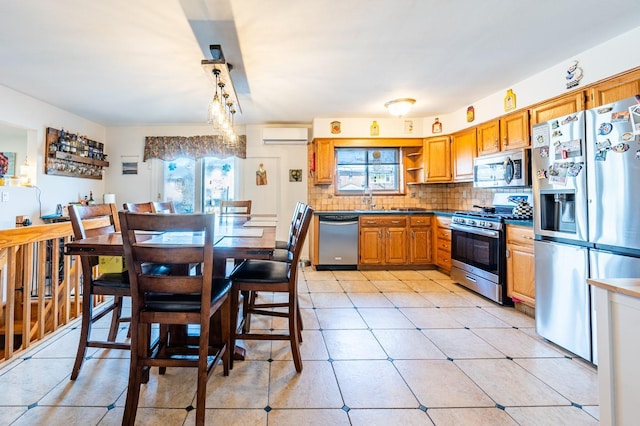 3125 Spencer Dr, Bronx, NY 10465 - kitchen with plenty of natural light, a wall unit AC, decorative backsplash, and appliances with stainless steel finishes