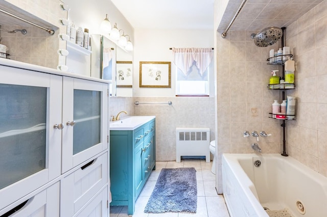 3125 Spencer Dr, Bronx, NY 10465 - full bath with toilet, tile walls, radiator, vanity, and tile patterned floors
