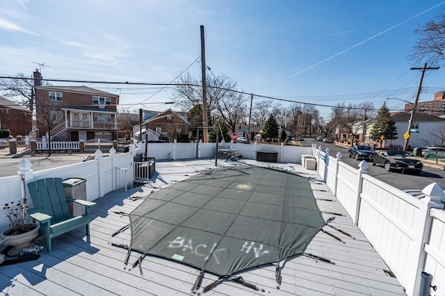 3125 Spencer Dr, Bronx, NY 10465 - wooden deck with a fenced backyard and a residential view