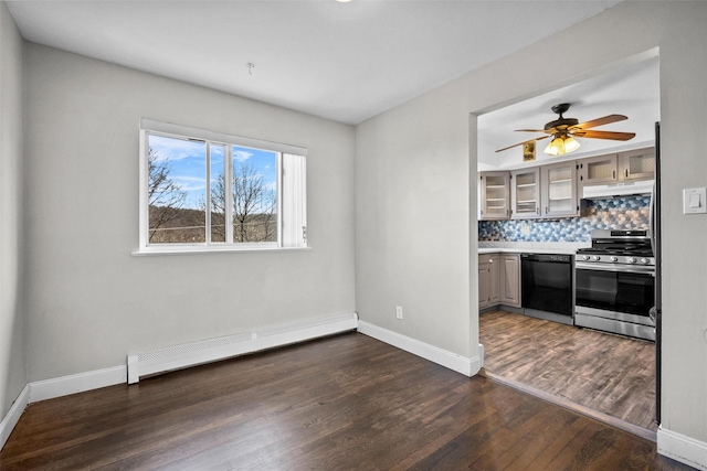 interior space featuring a ceiling fan, baseboards, baseboard heating, and dark wood-style flooring