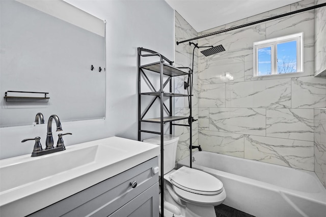 bathroom with vanity, toilet, and shower / bathtub combination