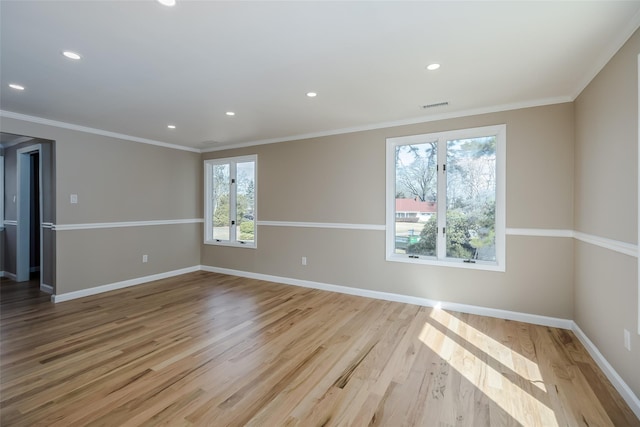 spare room featuring visible vents, ornamental molding, wood finished floors, recessed lighting, and baseboards