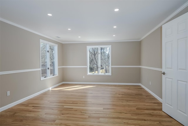 unfurnished room featuring recessed lighting, light wood-style flooring, baseboards, and ornamental molding