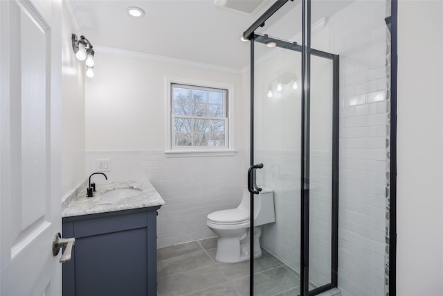 full bathroom featuring tile patterned floors, visible vents, ornamental molding, a shower stall, and vanity