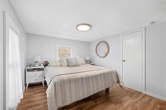 bedroom with wood finished floors