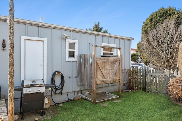 view of shed featuring fence