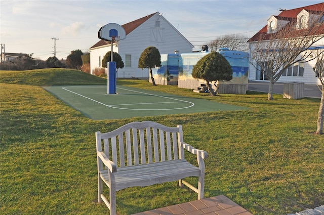 view of sport court featuring community basketball court and a yard