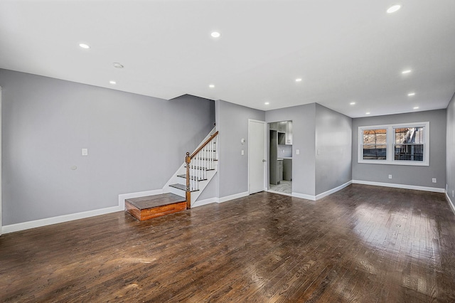 unfurnished living room with recessed lighting, baseboards, stairs, and hardwood / wood-style flooring