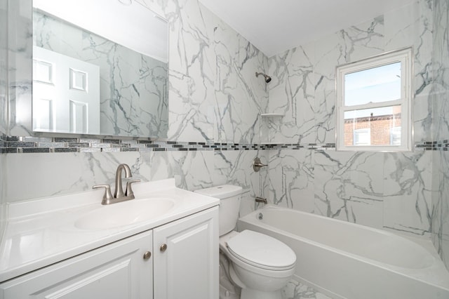 bathroom with vanity, toilet, washtub / shower combination, and marble finish floor