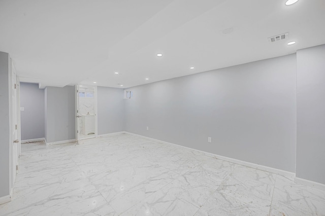 finished basement with recessed lighting, baseboards, visible vents, and marble finish floor