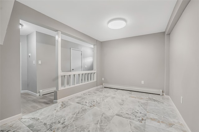 unfurnished room featuring baseboard heating, marble finish floor, baseboards, and a baseboard radiator