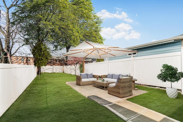 view of yard with outdoor lounge area, a patio area, and a fenced backyard