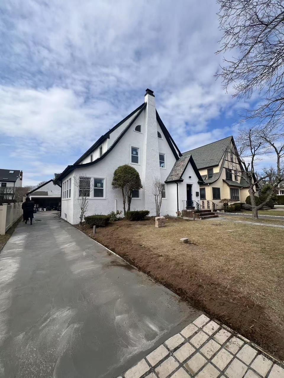 view of property exterior featuring a chimney and stucco siding