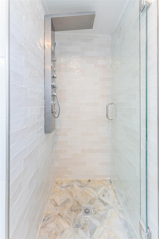 full bathroom featuring a shower stall