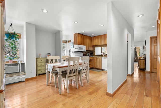 dining room featuring recessed lighting, light wood-style flooring, cooling unit, and baseboards